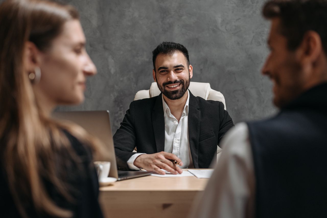 Home Business professional meeting with clients in a modern office setting. Ideal for corporate themes.